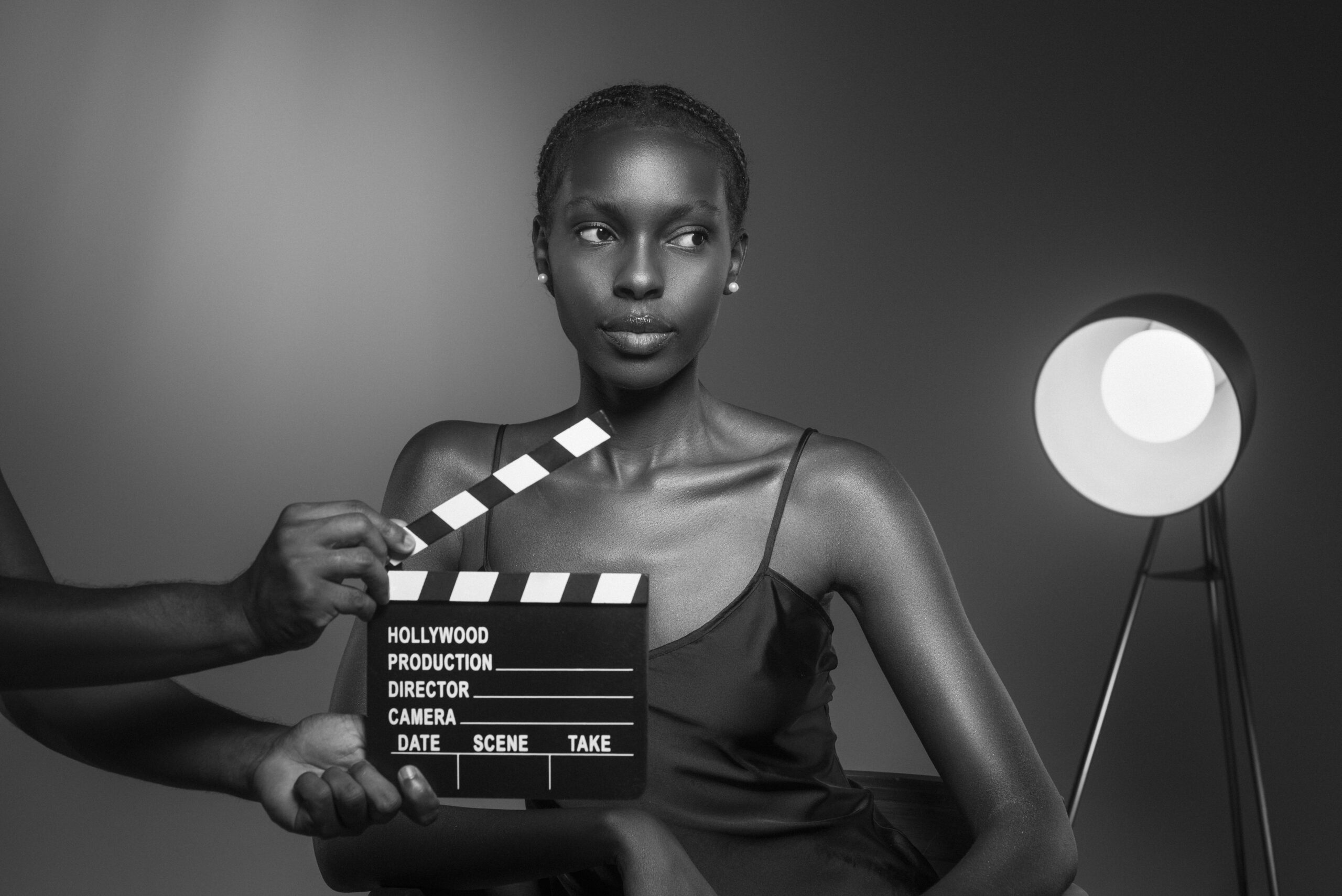 black-white-portrait-woman-with-clapperboard-old-hollywood-glamour-style